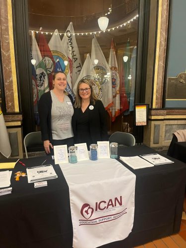 ICAN of Central Iowa chapter leaders tabling in the Iowa Capitol rotunda for the inaugural Maternal and Infant Health Day.